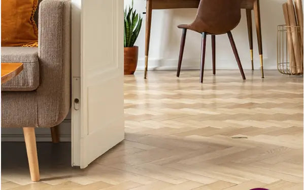 Herringbone Oak Flooring in room with a sofa and chair